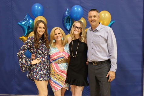 Family man - (L-R) Delaney (‘17), Kelly, Carlie (‘15) and Mike McCabe pose for a photo at the cheer banquet.