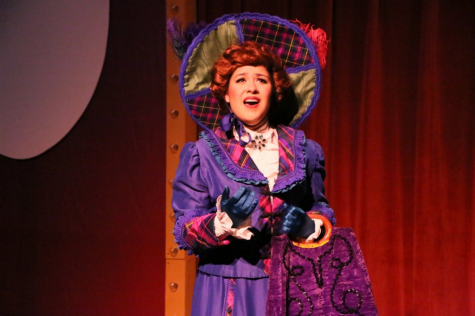 Senior Andrea Martinez on stage performing as the lead character in "Hello Dolly!".