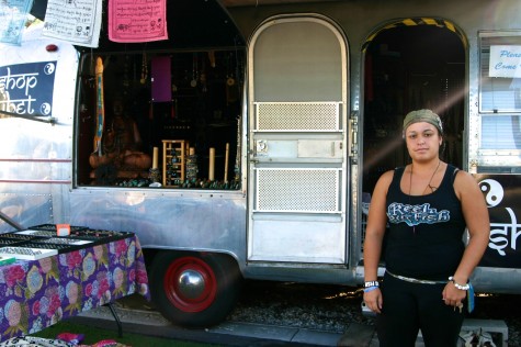 Goods from Asia - Adrianna Moncaba, shopkeeper of Shop Tibet, stands by her trailer.