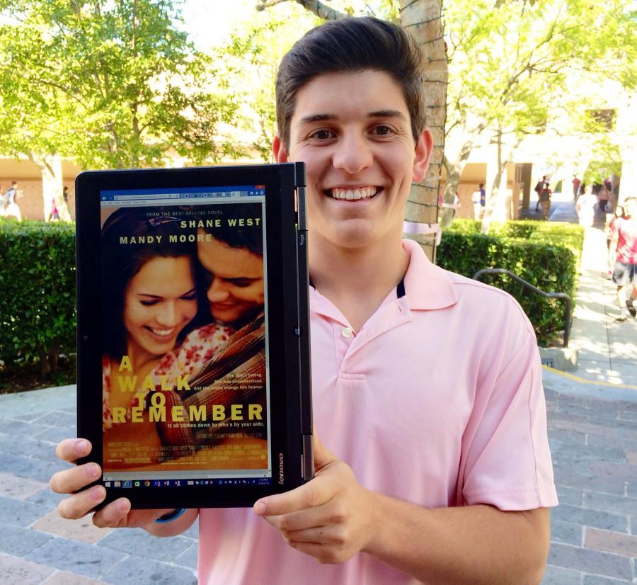 Alveraz holds a picture of his favorite movie, A Walk to Remember.