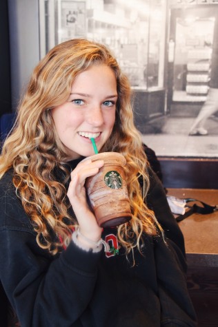 Senior Madeline Churchill smiles as she sips a Java Chip Frappuchino at the Starbucks on Antonio Parkway.