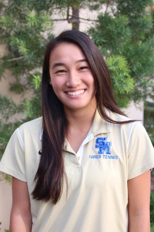 Queen of the court - Sophomore Katie Chang represents her  sport and her team by wearing the tennis team polo.