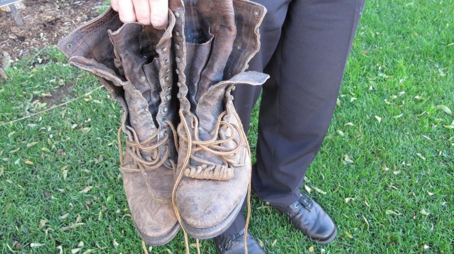 Religion teacher Peter Bennetts mule packing boots are worn with memories from the dusty trails.