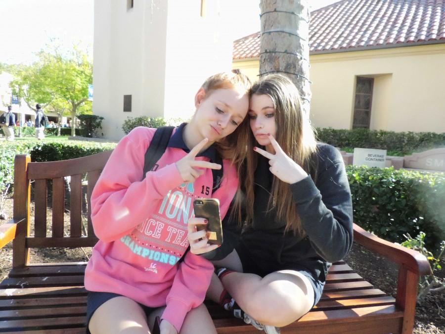 Snapping a selfie - Sophomores Emma Kearns and Gillian Wallace finish a day at school by posing for a funny photo to put on their signature Snapchat stories.