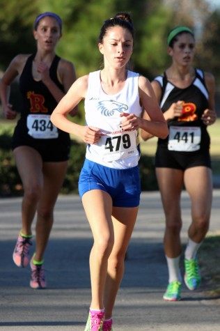 Junior Katie Moreno gives it her best during a varsity cross country race.