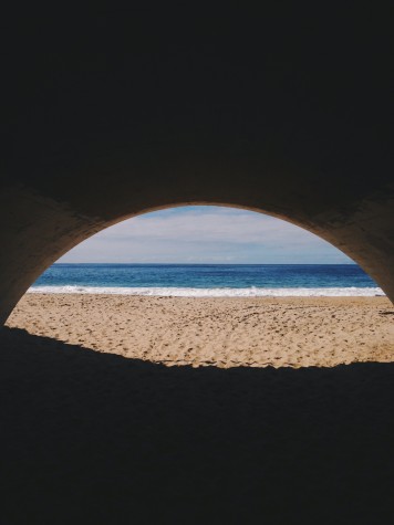 The tunnel connecting the parking lot to the beach opens up to a deserted paradise at El Moro Beach.