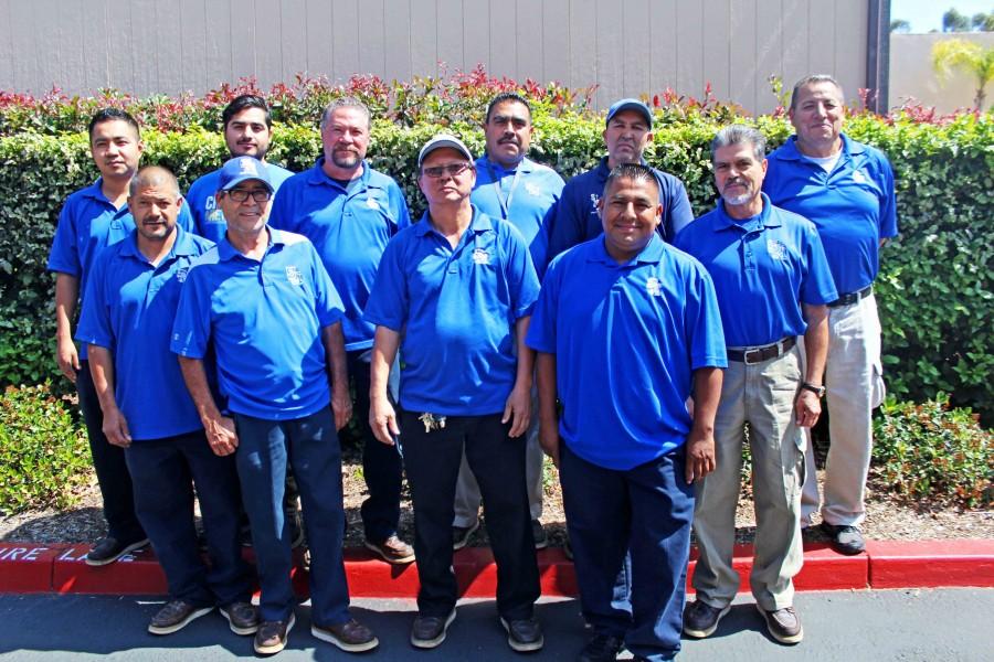 Squad goals - Eleven of the facilities maintenance crew members take a quick break in their busy afternoon schedules to pose for a group picture.