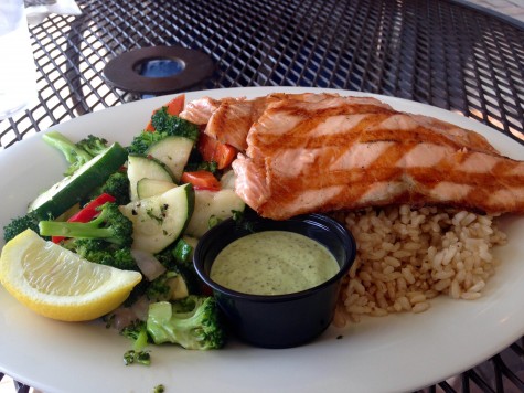 Full plate - This plate from Spike's Fish House is stocked full with healthy options: a steamed assortment of veggies, tasty brown rice, a lemon pesto sauce and wonderfully grilled salmon.