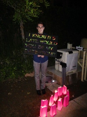 Broccardo sets up the ask with a sign, speakers and candles.