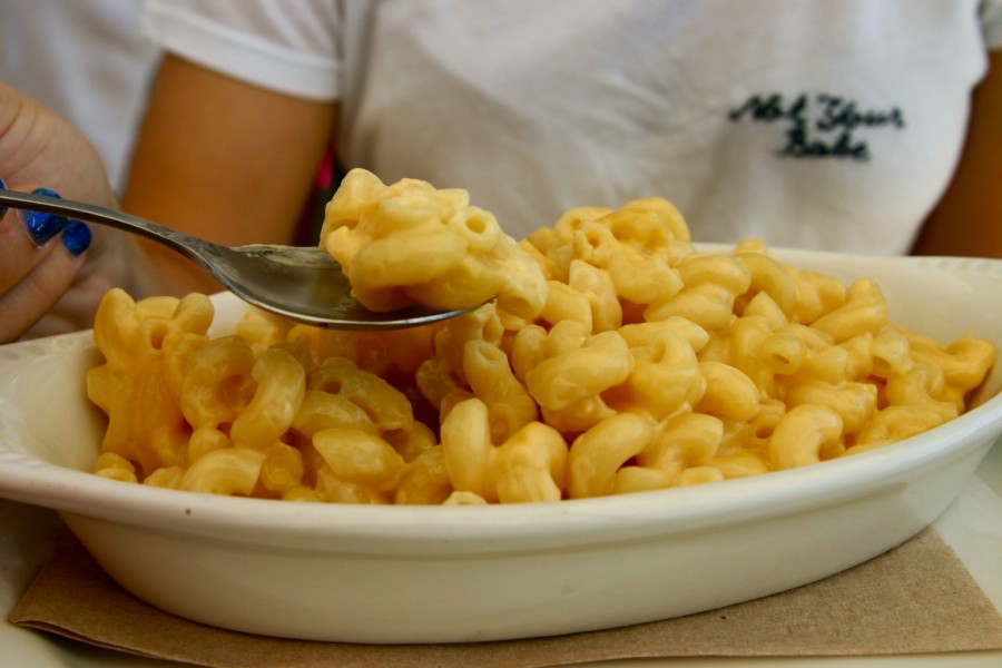 Senior Perla Shaheen scoops up a spoonful of Urth Caffes iconic mac and cheese