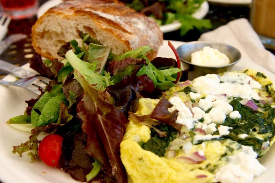 The spinach & feta omelet comes with a side of salad and bread and butter.