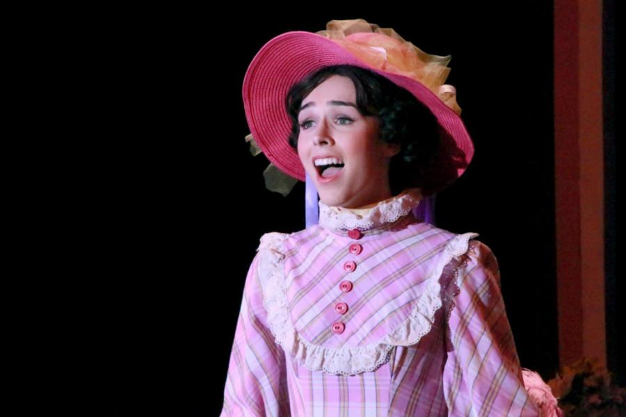Senior Sam Drust sings her heart out while playing Irene Malloy in Hello Dolly.