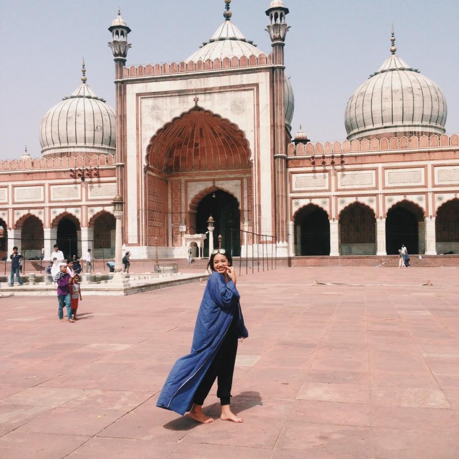 As a sign of respect, Chara follows the Indian tradition of removing her shoes before entering a mosque.