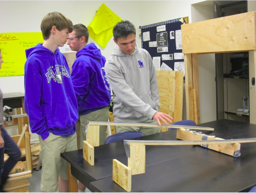 Sophomore Jack Evans and senior Bryan Leonor discuss possible prototypes for the FRC robot.