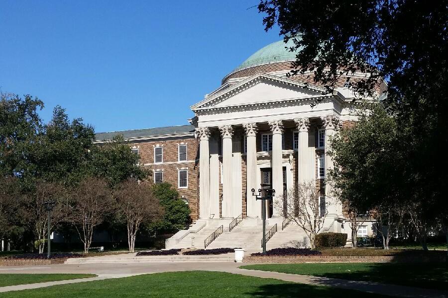 The domed building, Dallas Hall, is the infamous building seen everywhere -- including the schools seal.
