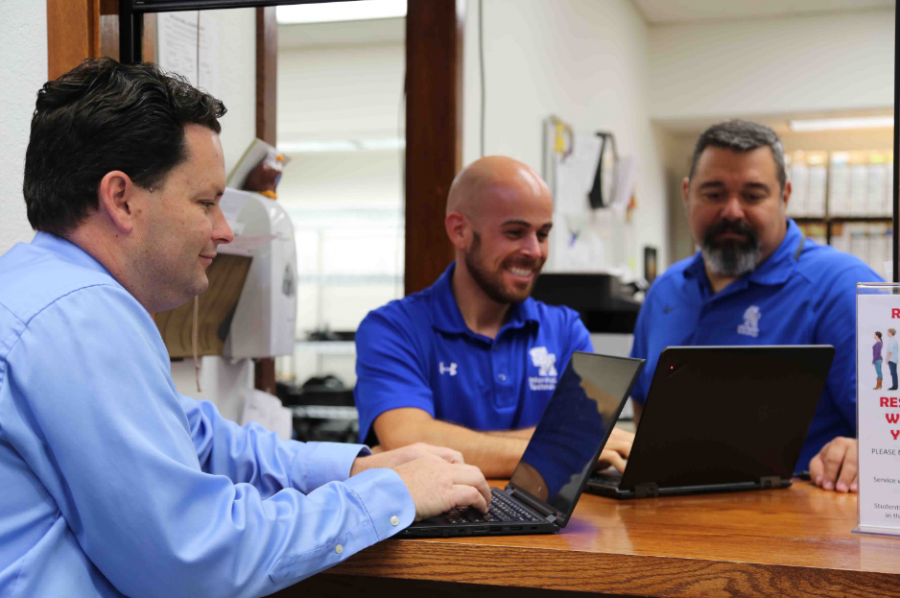 Scott Bricker (left), Kevin Hagan (middle) and Javier Hernandez (right) explore new ways to improve the tablet program. 