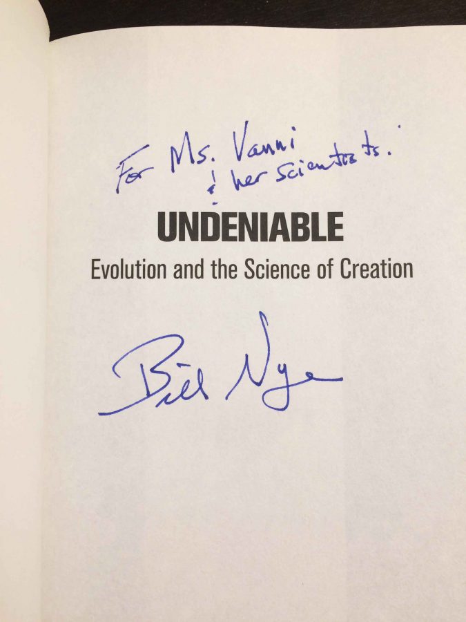 Bill Nye signs his book for Megan Vanni, mentioning her students at SMCHS.