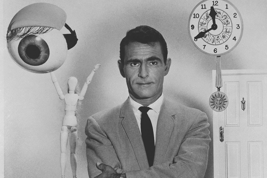 The legend - Rod Serling stands with objects famous from the opening sequence of The Twilight Zone.

