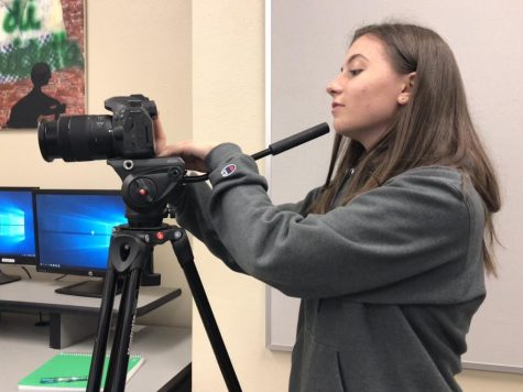 Markie takes a video for her Film class. Markie started out by creating iMovie videos with her friends in middle school.