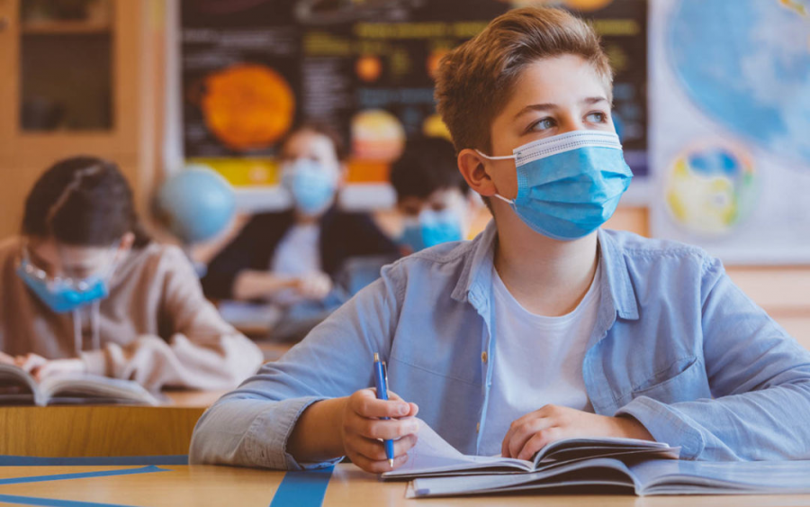 With schools opening, students must wear masks during class as shown above.