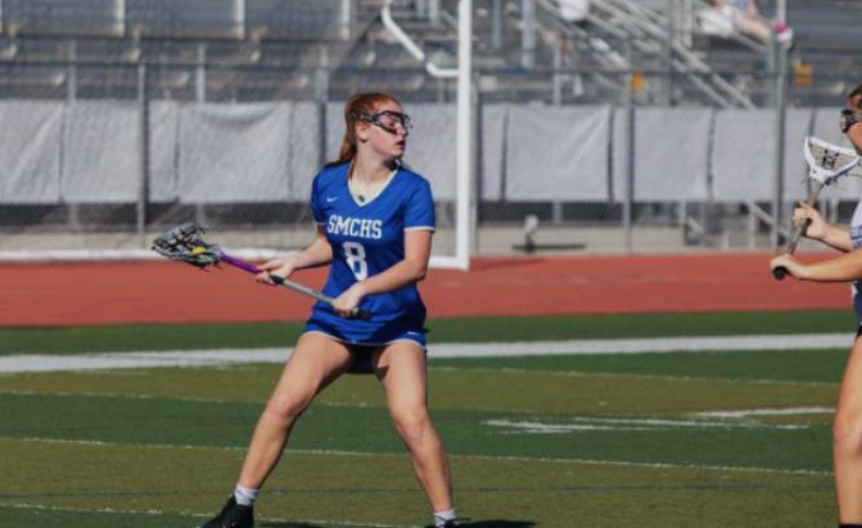 Freeborn plays in a lacrosse game last year. Playing multiple sports and keeping up with her schoolwork has taken a toll on the athletes mental and physical health.