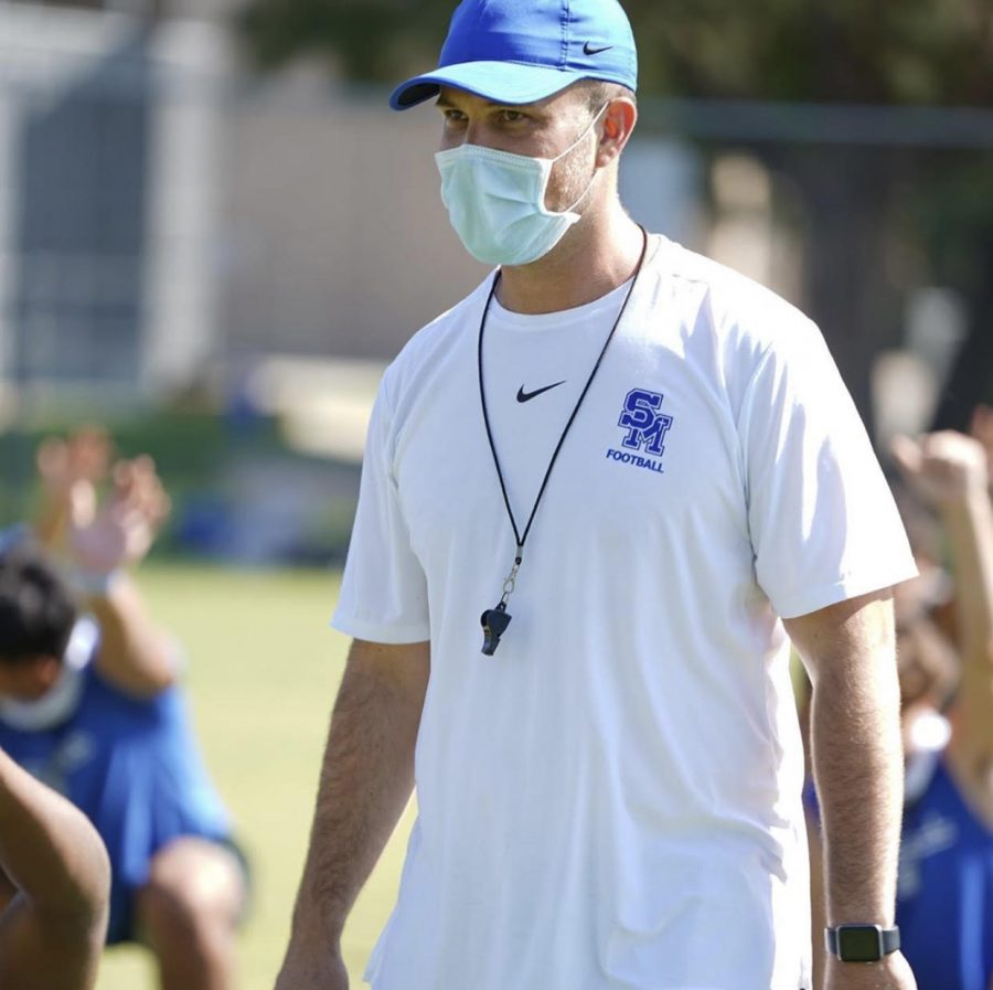 Restricted- The Eagles warm up for practice. New coach Anthony Rouzier sets the example by wearing a mask.