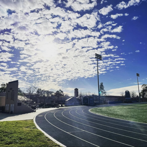 A sunny day sheds light on the track and the happy runners. The students have waited for months for their season to start.
