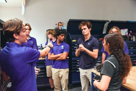 Andrew Douglas teaching students machining