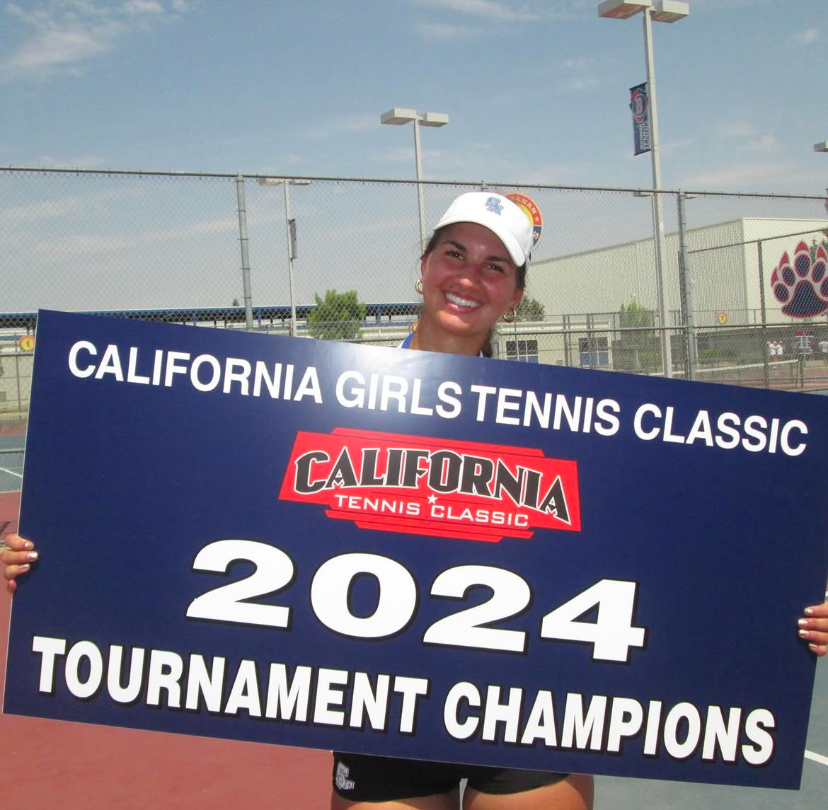 Sheridan posing after winning a tournament